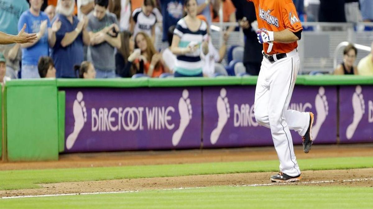 Miami Marlins pitcher Jose Fernandez rounds third base after hitting a solo home run in the sixth inning of a baseball game against the Atlanta Braves on Sept. 11, 2013, in Miami.