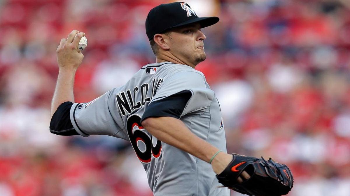 
Miami Marlins starting pitcher Justin Nicolino throws in the first inning of a baseball game against the Cincinnati Reds, Saturday, June 20, 2015, in Cincinnati.
