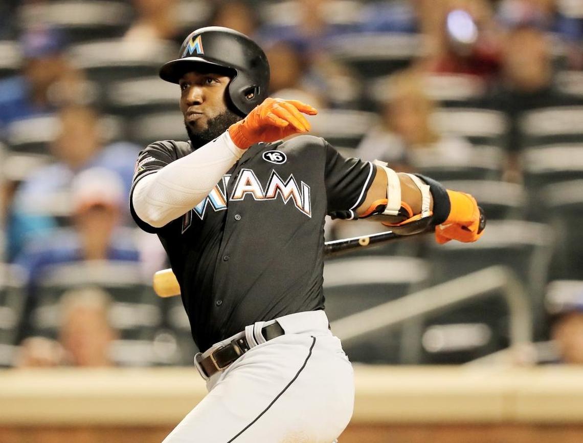 Miami Marlins’ Marcell Ozuna (13) hits an RBI single in the sixth inning against the New York Mets on August 19, 2017 at Citi Field in the Flushing neighborhood of the Queens borough of New York City.
