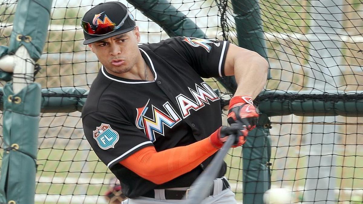 Giancarlo Stanton swings during the first full squad practice of spring training at Roger Dean Stadium in Jupiter on Tuesday, February 23, 2016.
