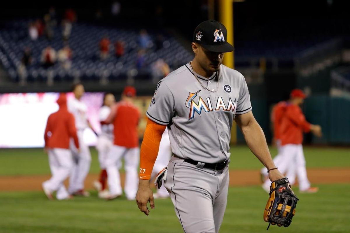Miami Marlins' Giancarlo Stanton walks off the field after Philadelphia Phillies' Nick Williams hit a game-wining double during the 15th inning early Wednesday, Sept. 13, 2017, in Philadelphia. Philadelphia won 9-8.