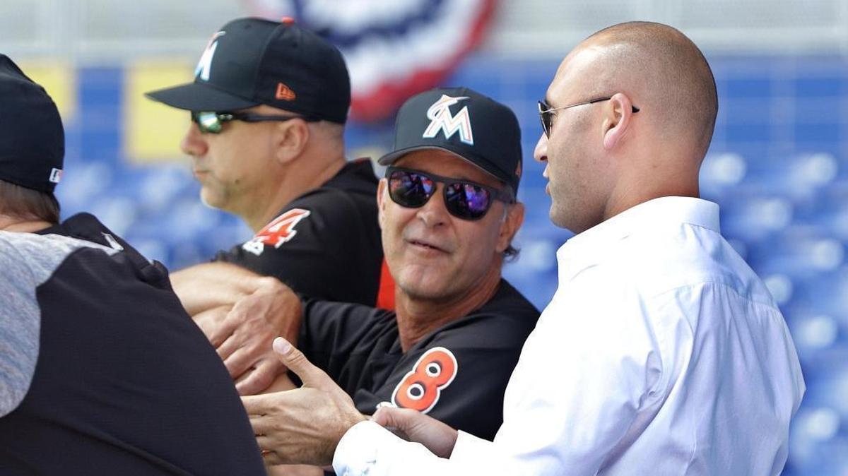 Miami Marlins CEO Derek Jeter, right, chats with Manager Don Mattingly, during a team stretch/workout a day before season opening's work out day at Marlins Park on Wed., March 28, 2018.