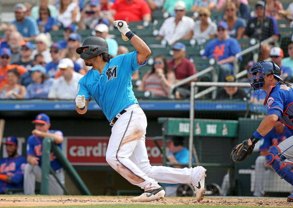 Miami Marlins catcher Jorge Alfaro (38) hits a single during the fourth inning of a Major League Baseball spring training game against the New York Mets at the Roger Dean Chevrolet Stadium on Tuesday, March 5, 2019 in Jupiter, FL.