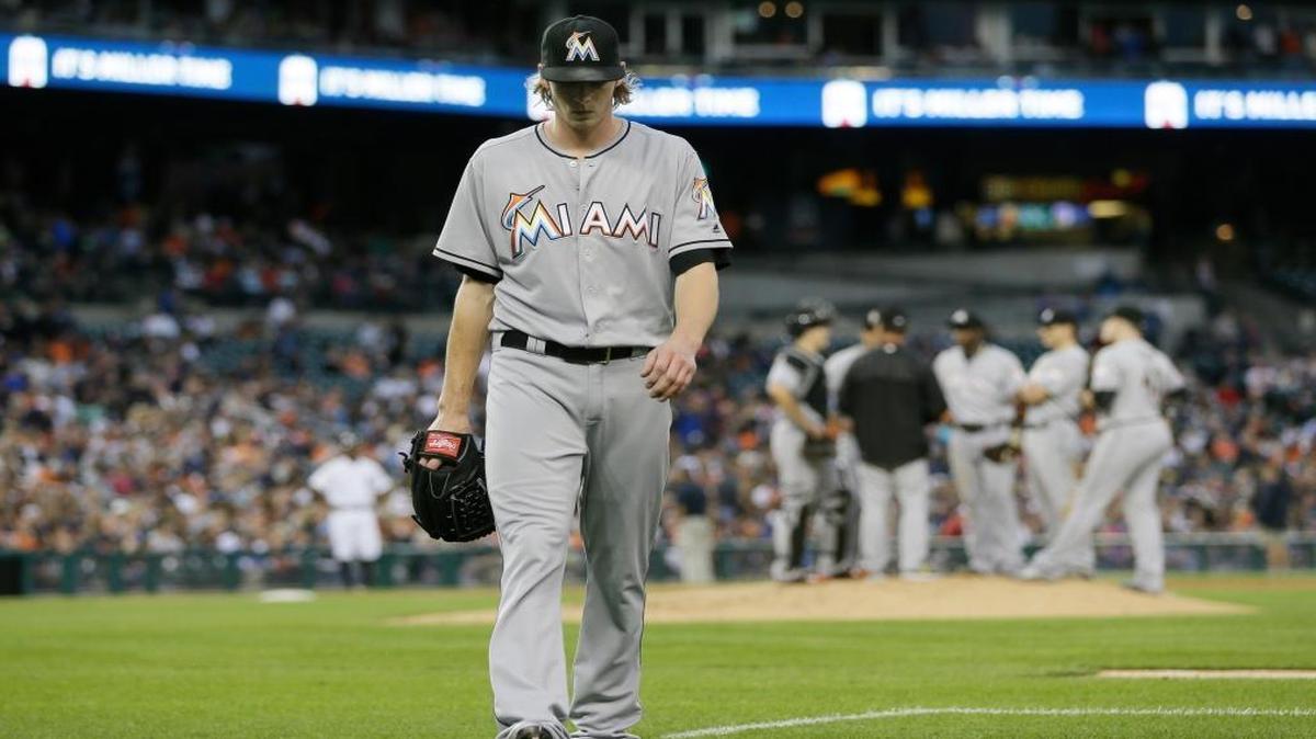 Miami Marlins starting pitcher Adam Conley walks back to the dugout after being relieved during the fifth inning of a baseball game against the Detroit Tigers, Tues., June 28, 2016, in Detroit.