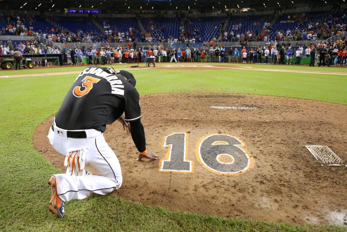 Miami shortstop Adeiny Hechavarria prays kneeling at the mound near Jose Fernandez’s No. 16 after the game against the New York Mets on Sept. 28, 2016 at Marlins Park in Miami.
