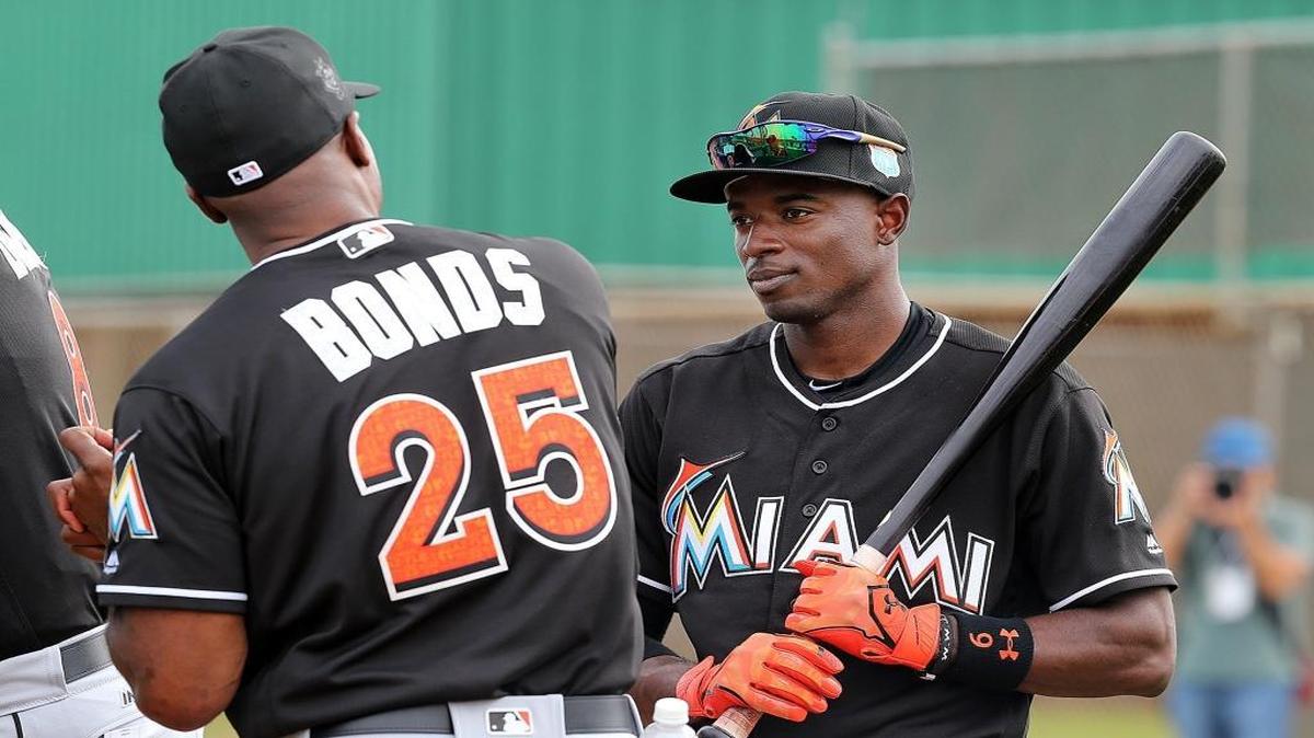 Miami Marlins hitting coach Barry Bonds, talks with Dee Gordon, during the first full squad practice of spring training at Roger Dean Stadium on Jupiter Tuesday, February 23, 2016.
