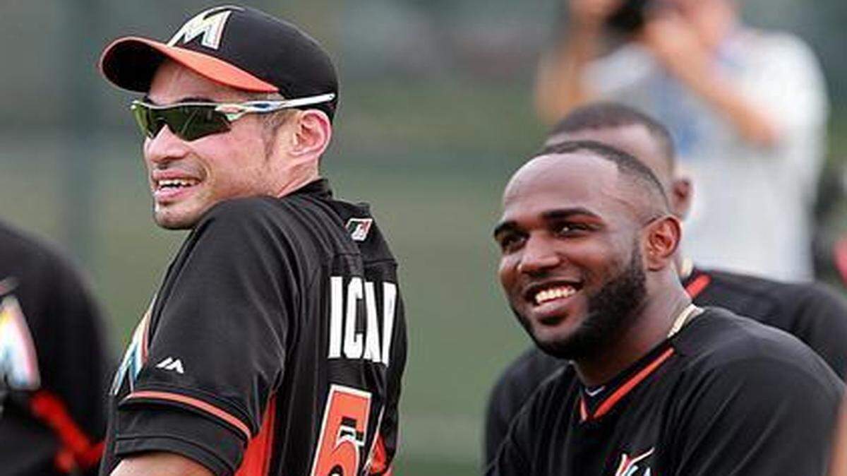 
Miami Marlins outfielders Ichiro Suzuki and Marcell Ozuna share a laugh during spring training at Roger Dean Stadium in Jupiter on Tuesday, Feb. 24, 2015.

