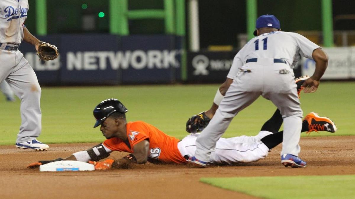 
Dee Gordon is tagged out by Jimmy Rollins during the Miami Marlins’ game against the Los Angeles Dodgers on Sunday, June 28, 2015 at Marlins Park in Miami.
