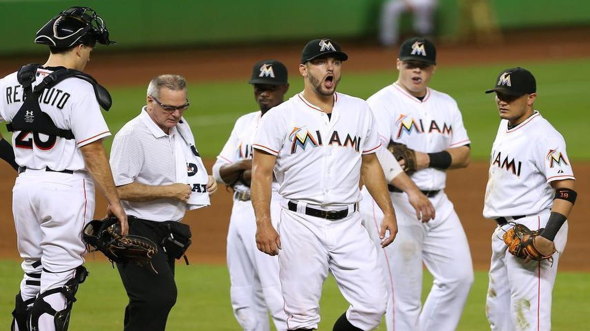 
Jarred Cosart, pitcher of the Miami Marlins, reacts after being hit by a line drive in the fourth inning of a baseball game against the Philadelphia Phillies on Thursday, September 24, 2015, at Marlins Park in Miami.
