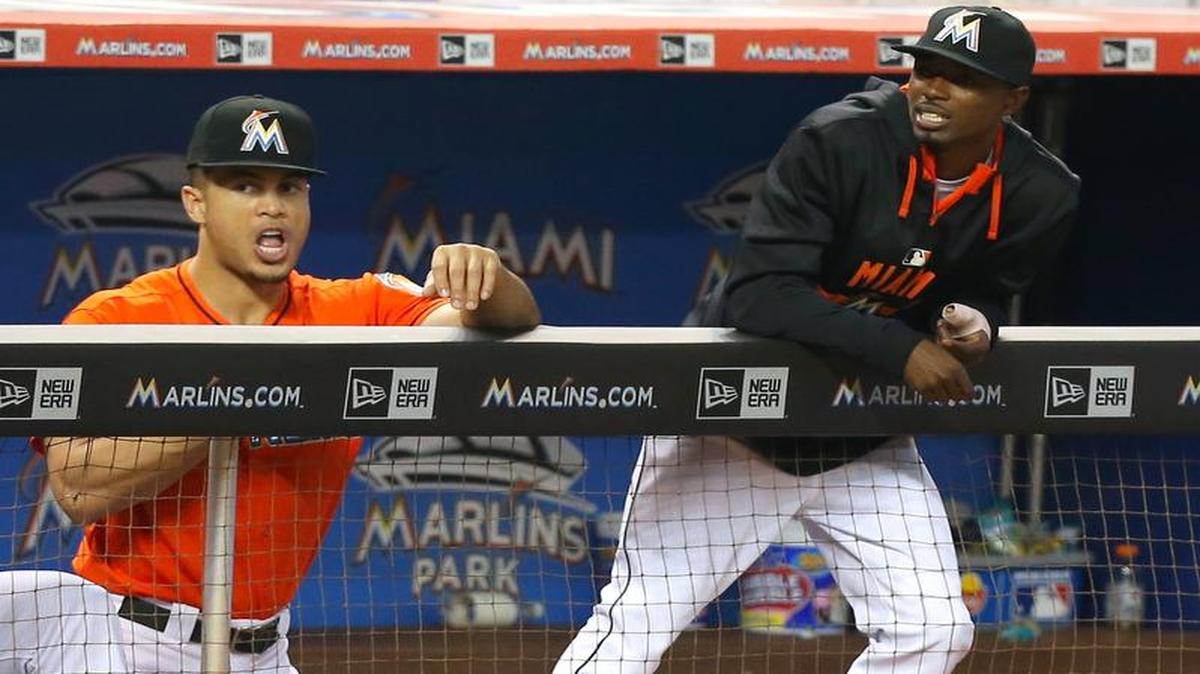 
Giancarlo Stanton of the Miami Marlins talks with teammate Dee Gordon in the fifth inning of a baseball game against the Cincinnati Reds on Sunday, July 12, 2015, at Marlins Park in Miami.

