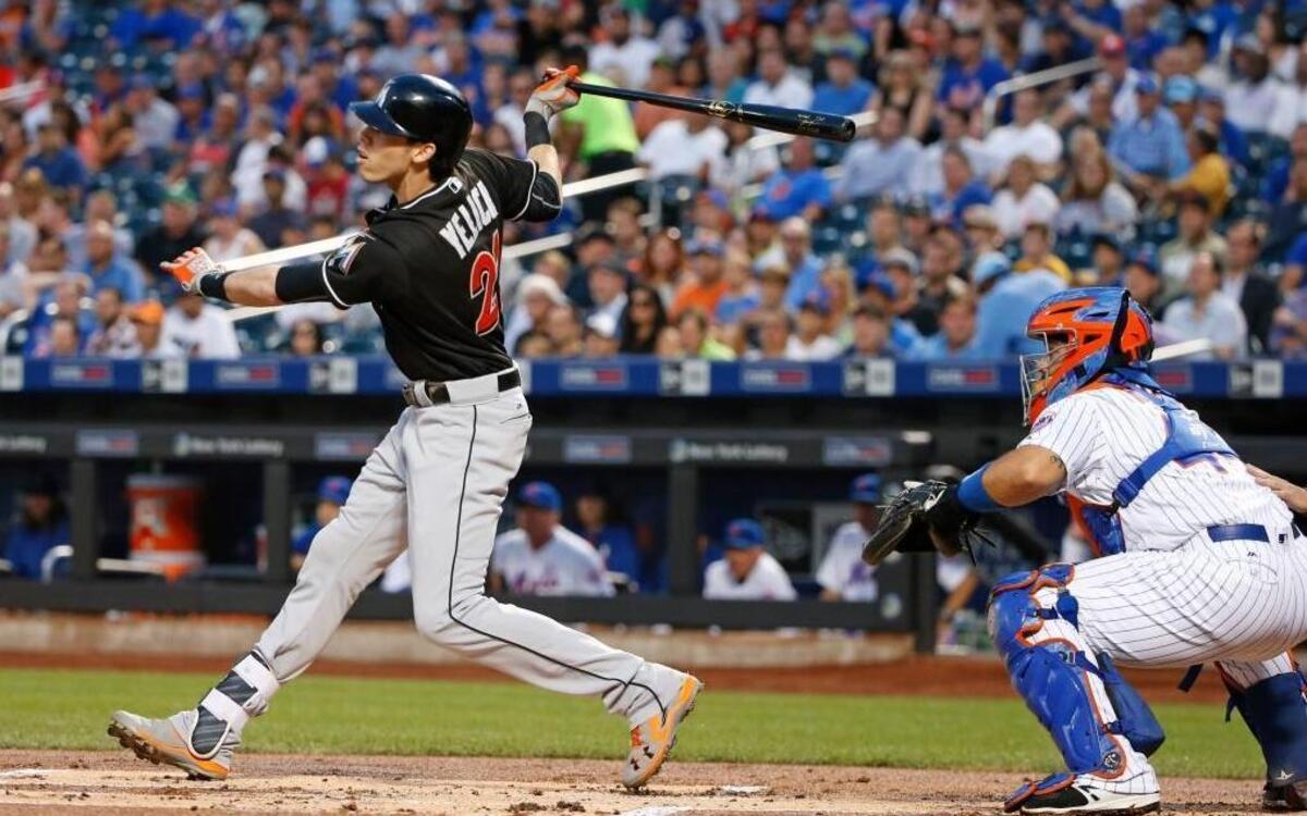Miami Marlins' Christian Yelich, left, and New York Mets catcher Rene Rivera watch Yelich's first-inning, two-run home run in a baseball game Tues., Aug. 30, 2016, in New York.