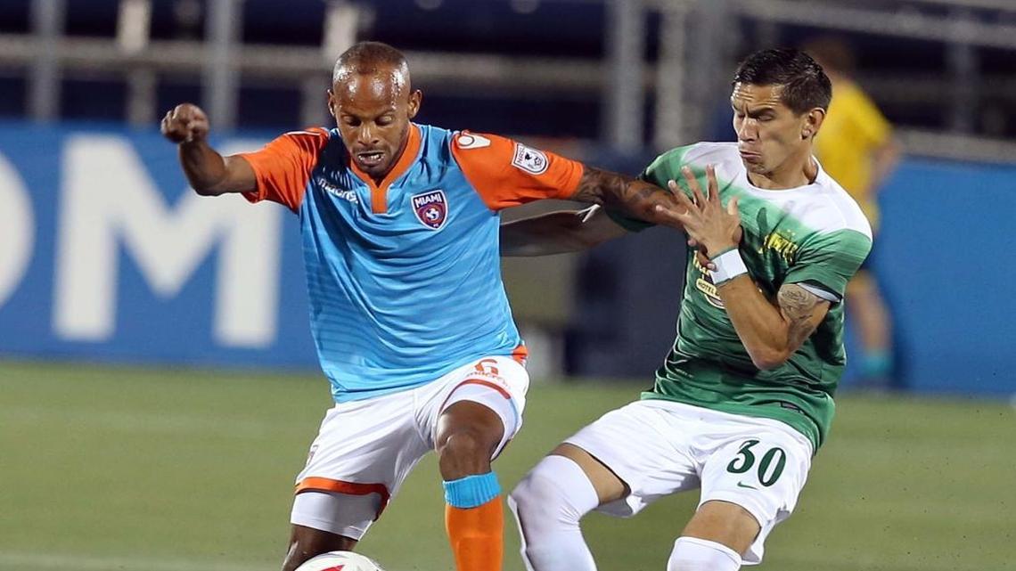 Miami FC forward Ariel Martinez, left, dribbles against the Rowdies’ Eric Avila during Miami’s home debut.