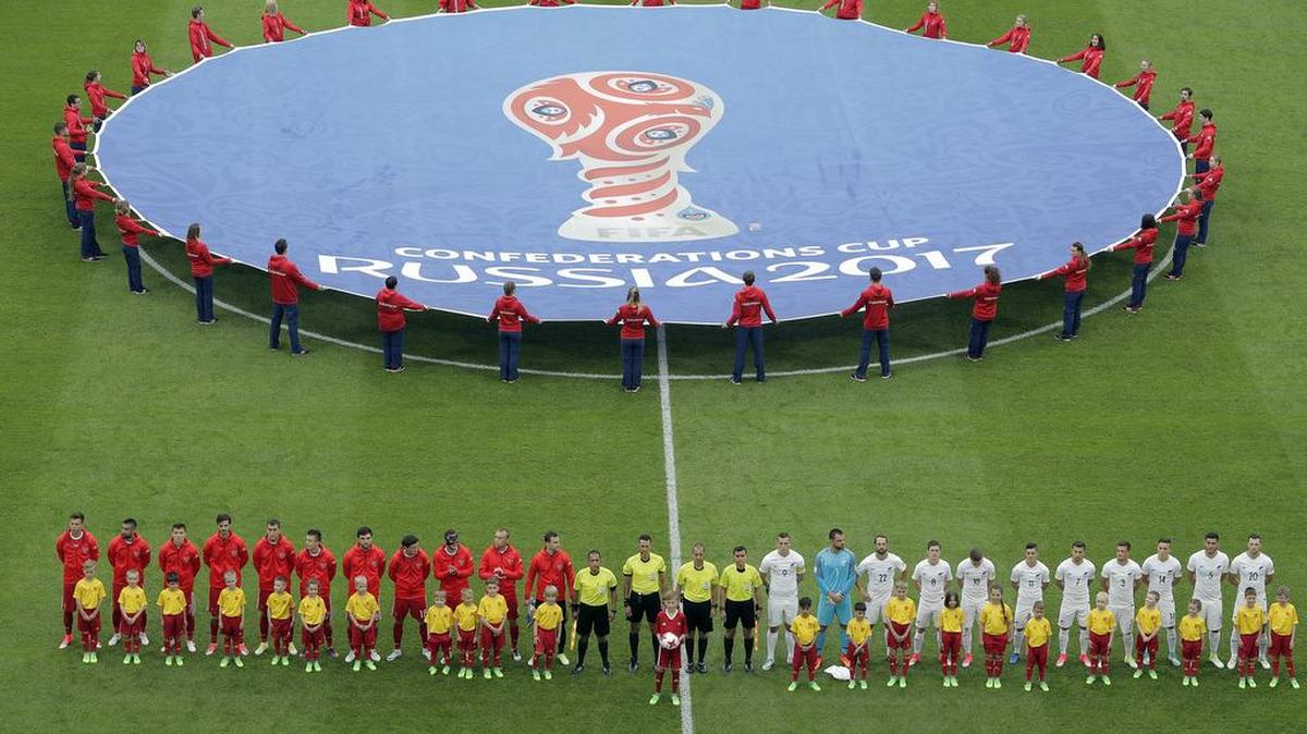 The players of Russia, left, and New Zealand line up before the Confederations, Cup Group A soccer match between Russia and New Zealand, at the St. Petersburg stadium in St. Petersburg, Russia on June 17, 2017.
