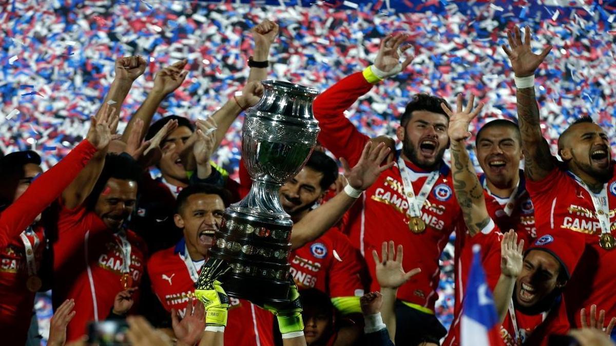 Chile's players hold up the Copa America trophy after the final soccer match against Argentina at the National Stadium in Santiago, Chile, Saturday, July 4, 2015. Chile's Bravo made a save and striker Alexis Sanchez converted the winning penalty as host Chile defeated Argentina 4-1 in a shootout after a 0-0 draw in the Copa America final on Saturday, finally winning its first major title.