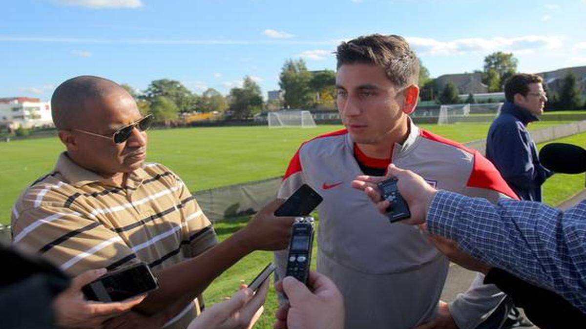 
Alejandro Bedoya speaks to the media during a U.S. soccer training session at Ohiri Field on Oct. 8, 2014 in Boston.
