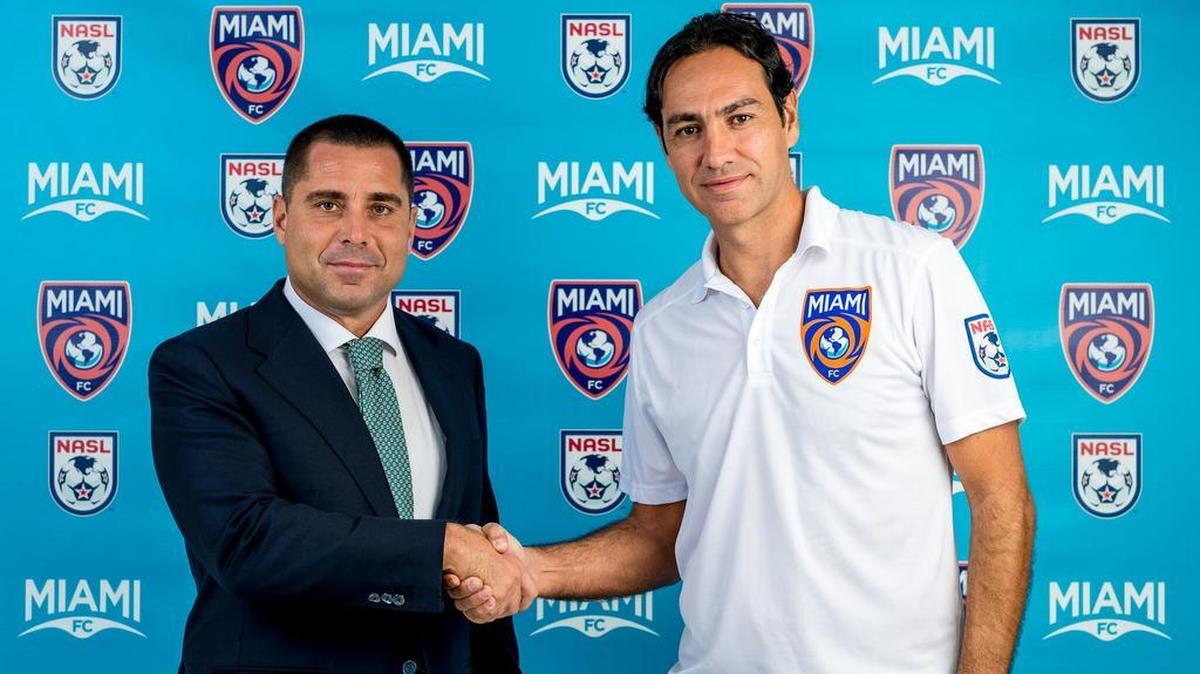 
New Miami FC coach Alessandro Nesta, right, shakes hands with team owner Riccardo Silva
