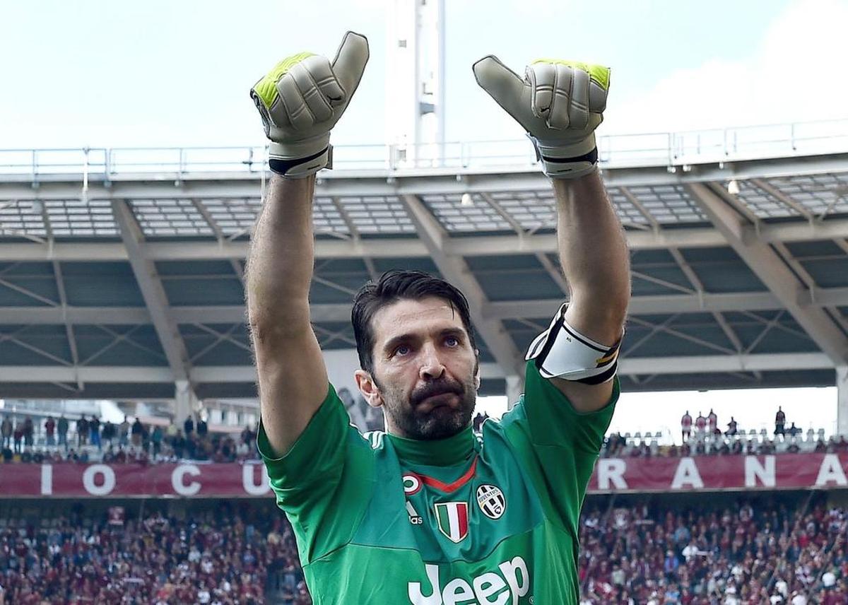 Juventus goalkeeper Gianluigi Buffon celebrates at the end of a Serie A soccer match between Torino and Juventus at Turin's Olympic stadium, Sun., March 20, 2016. Buffon has broken one of Serie A's greatest records, going 930 consecutive minutes without conceding a goal.