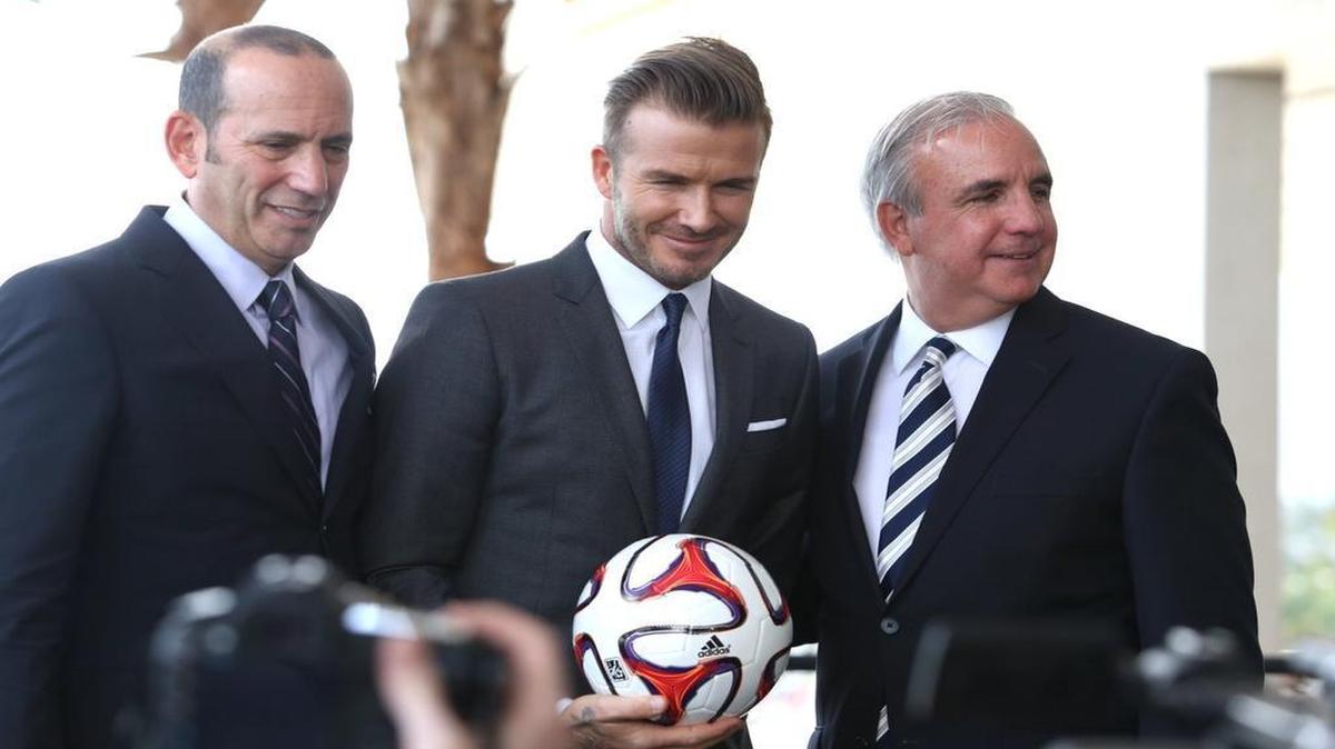 
David Beckham, center, poses with MLS commisioner Don Garber, left, and Miami-Dade mayor Carlos Gimenez at the Perez Art Museum on February 4, 2014.

