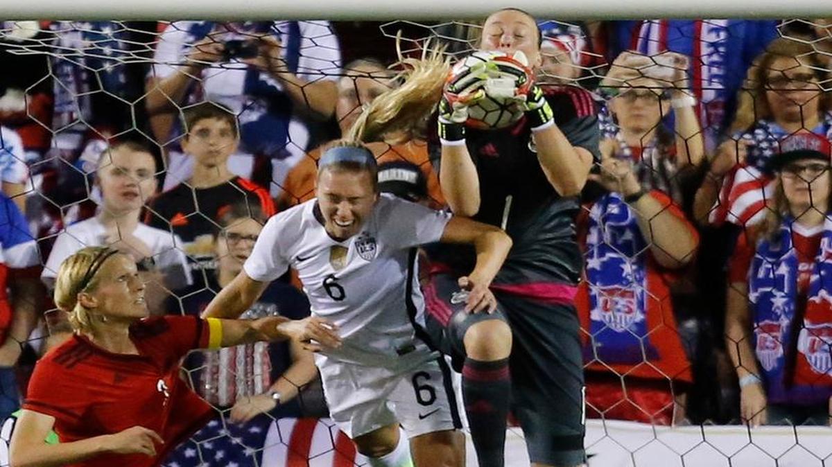 Germany goalkeeper Almuth Schult (1) catches the ball as United States player Whitney Engen tries to gain possession during the first half of a soccer game in the SheBelieves Cup, Wednesday, March 9, 2016, in Boca Raton, Florida.
