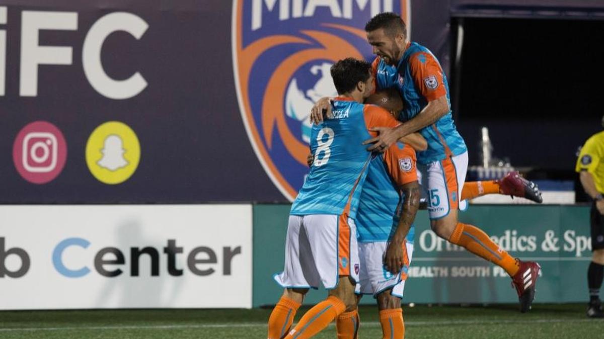 Miami teammates Vincenzo Rennella, left, and Hunter Freeman, right, congratulate Ariel Martinez for a goal during the team’s game against the Jacksonville Armada at Riccardo Silva Stadium in Miami on June 17, 2017.