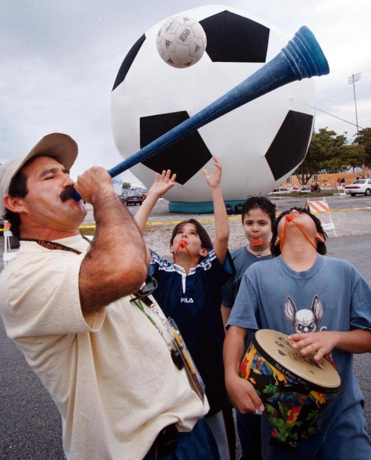 Fans cheer on Miami’s first MLS team, the Miami Fusion in a parking lot on March 13, 1998.