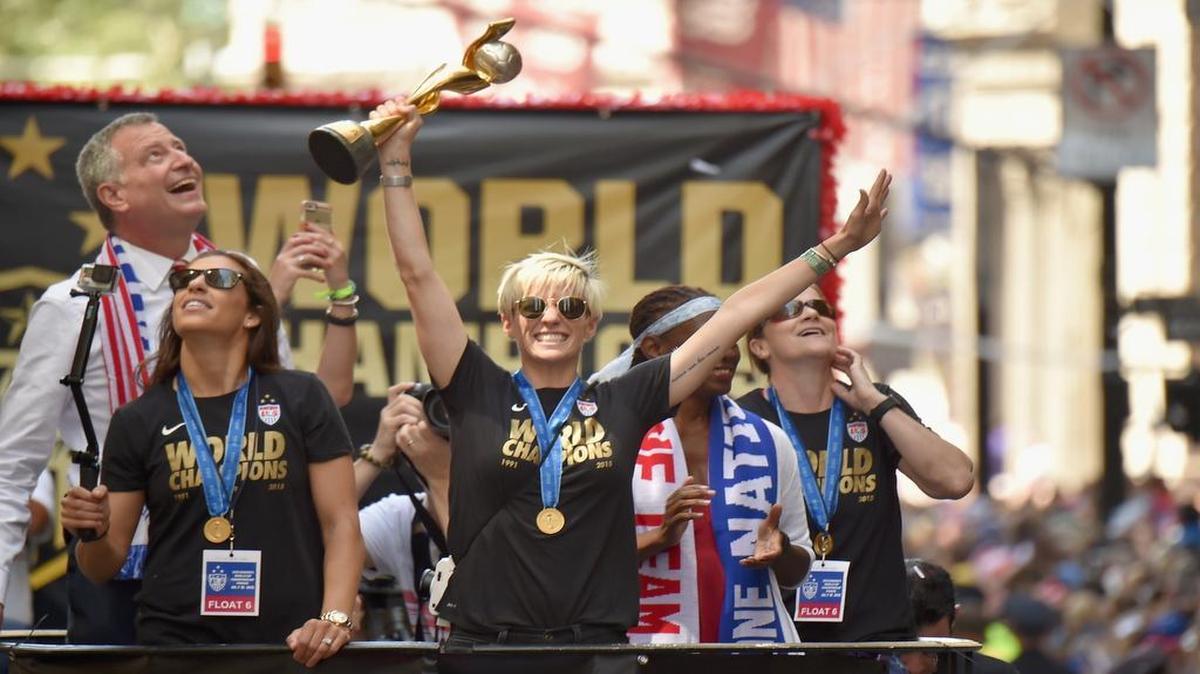 
Mayor Bill de Blasio, soccer players Carli Lloyd and Megan Rapinoe, Chirlane McCray and U.S. Coach Jill Ellis aboard a float in the New York City Ticker Tape Parade for World Cup Champions U.S. Women's Soccer National Team on July 10, 2015 in New York City.
