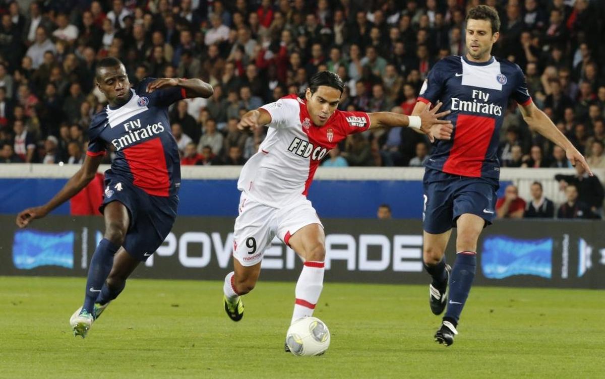 Monaco's Radamel Falcao of Colombia, center, challenges for the ball with Paris Saint Germain's Blaise Matuidi, left, and Thiago Motta of Italy during their French League One soccer match, Sun., Sept. 22, 2013, in Parc des Princes stadium, in Paris, France.