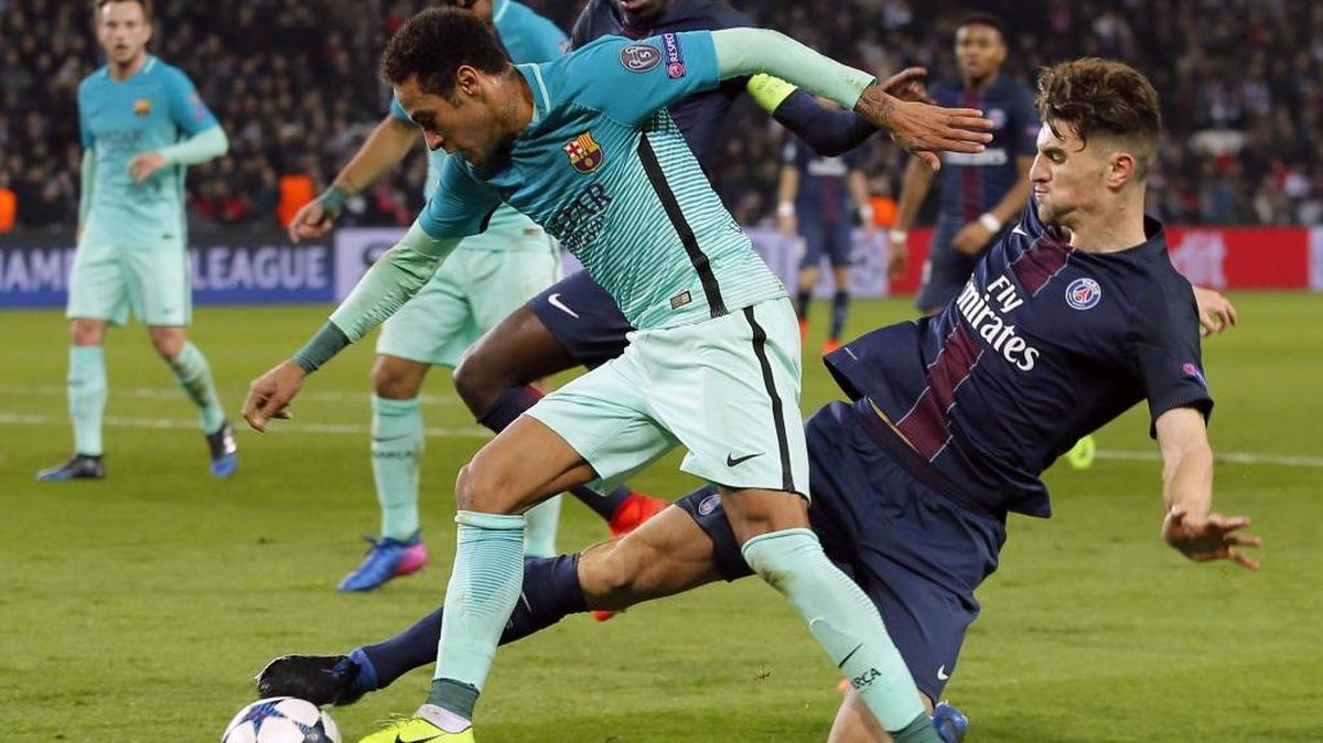 Barcelona’s Neymar (front) battles Paris Saint-Germain’s Thomas Meunier in the Champions League last summer. Both clubs will play at Hard Rock Stadium this summer.