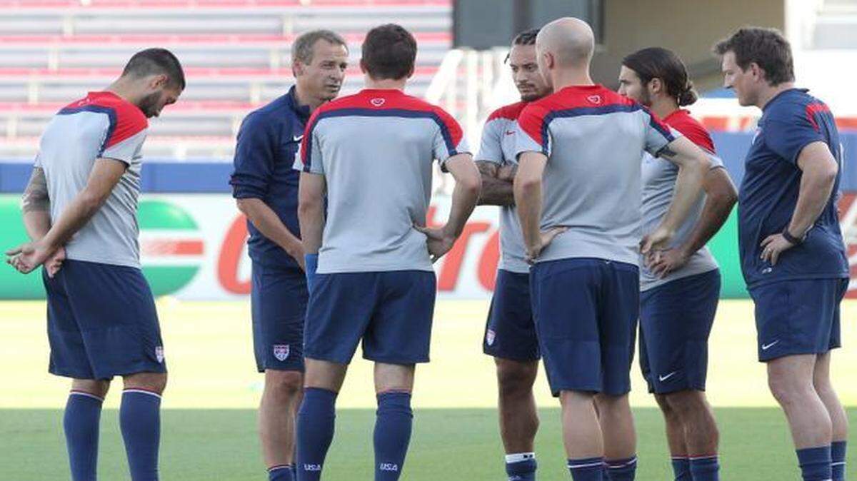 
U.S. men’s national soccer team head coach Jurgen Klinsmann (center) talks to players during a practice on Oct. 13, 2014 at FAU Stadium in Boca Raton.
