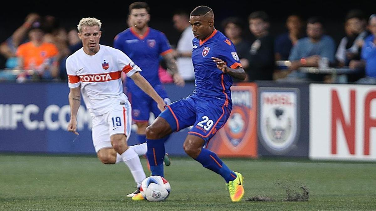The Miami FC's forward Stefano Pinto, drives against FC Cincinnati's MF Corben Bone, during the first half of quarterfinals of the U.S. Open Cup at Riccardo Silva Stadium at FIU in Miami on Wed., Aug. 2, 2017.