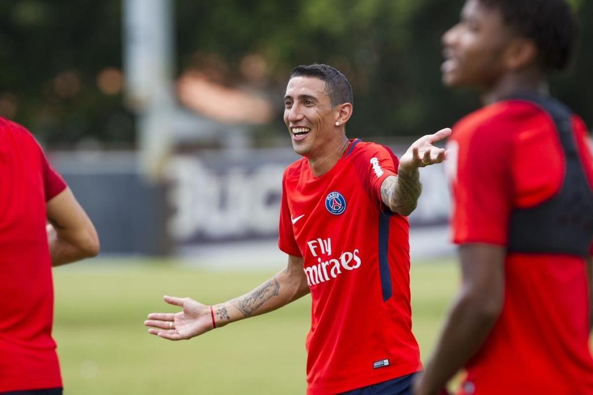 Paris Saint-Germaine's Angel Di Maria shares a laugh with his teammates at PSG's practice at Barry University on Mon., July 24, 2017.