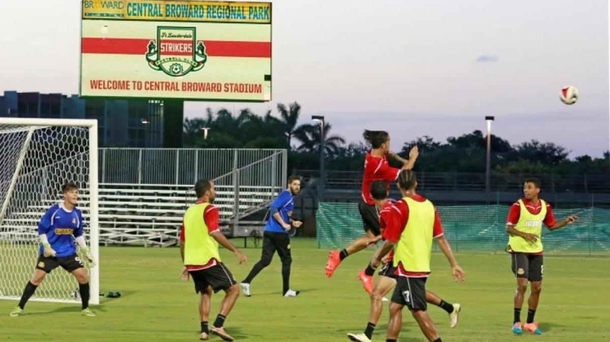 The Fort Lauderdale Strikers work out at their new home -- Central Broward Stadium in Lauderhill -- on Thursday evening.
