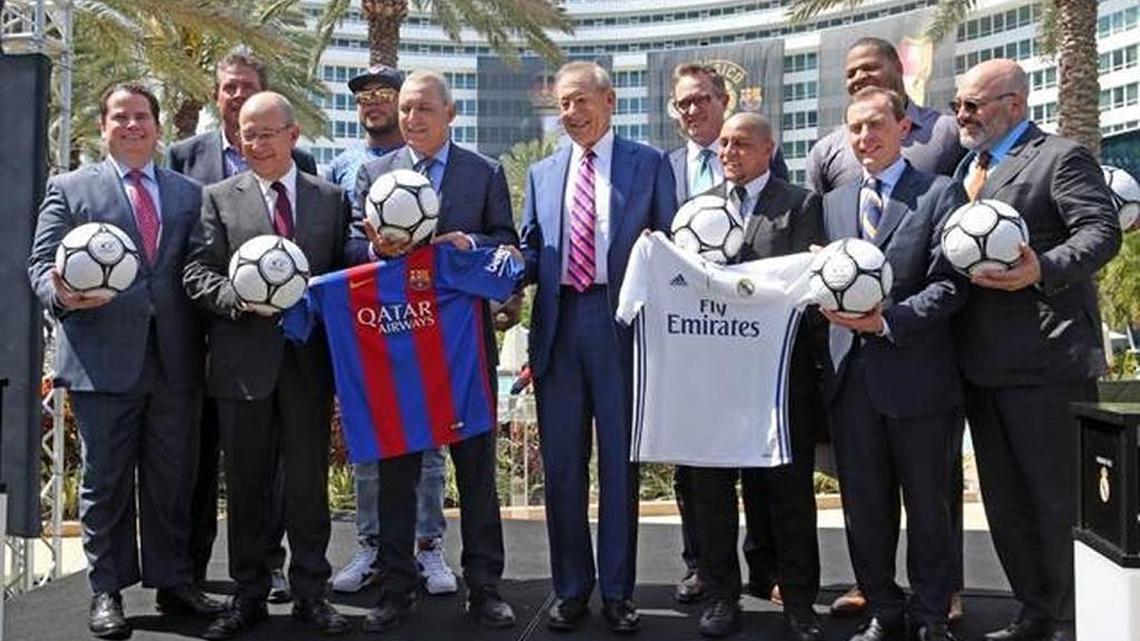 Miami Dolphins owner Stephen Ross, center, standing with local celebrities and soccer contingent, announces that FC Barcelona and Real Madrid soccer teams will meet on July 29, 2017, at Hard Rock Stadium as part of the 2017 International Champions Cup. Ross announced the event at the Fontainebleau Hotel on Miami Beach, Friday, March 10, 2017.