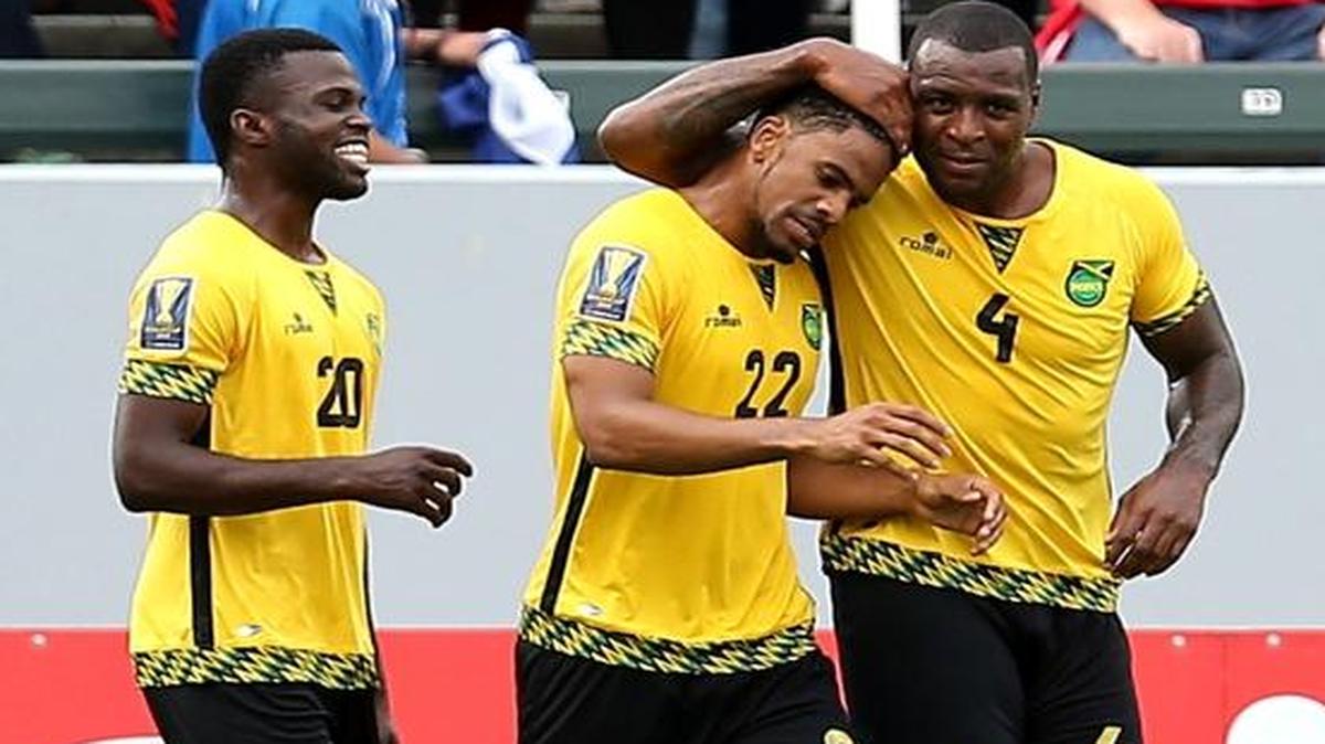 Jamaica’s Jermaine Taylor #22 celebrates with Westley Morgan #4 and Kemar Lawrence #20 after his first-half goal against Costa Rica in their CONCACAF Gold Cup Group B match at StubHub Center on July 8, 2015 in Los Angeles, California. 
