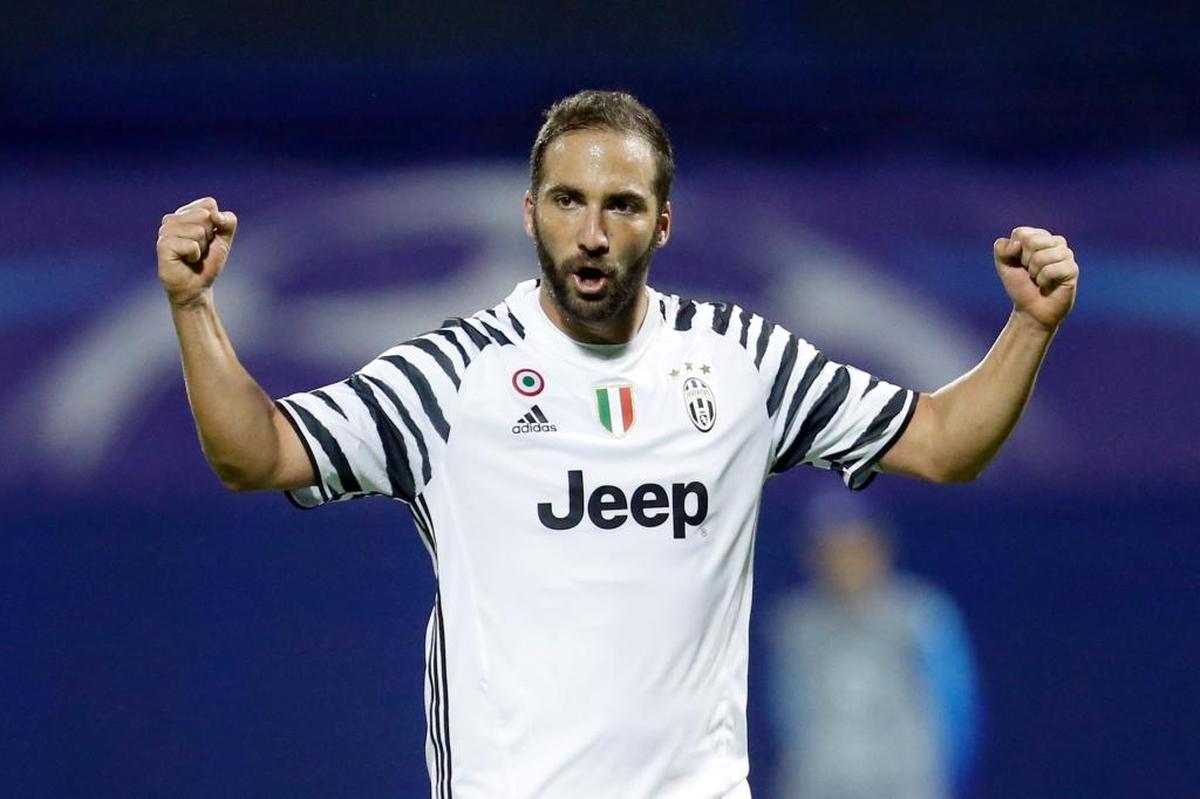 Juventus's Gonzalo Higuain celebrates after team mate Miralem Pjanic scored his side's first goal during the Champions League Group H soccer match between Dinamo Zagreb and Juventus, at Maksimir stadium in Zagreb, Croatia, Tues., Sept. 27, 2016.