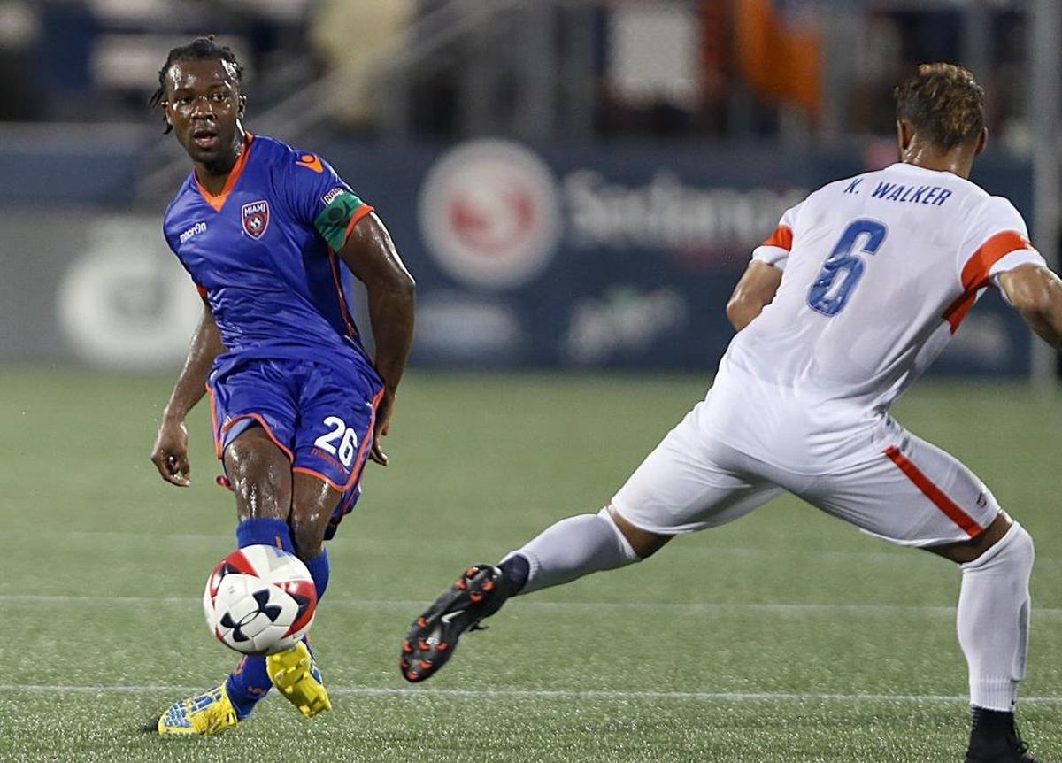 The Miami FC's Midfielder Michael Lahoud #26, drives against FC Cincinnati's MF Kenny Walker #6, during the first half of quarterfinals of the U.S. Open Cup at Riccardo Silva Stadium at FIU in Miami on Wed., Aug. 2, 2017.