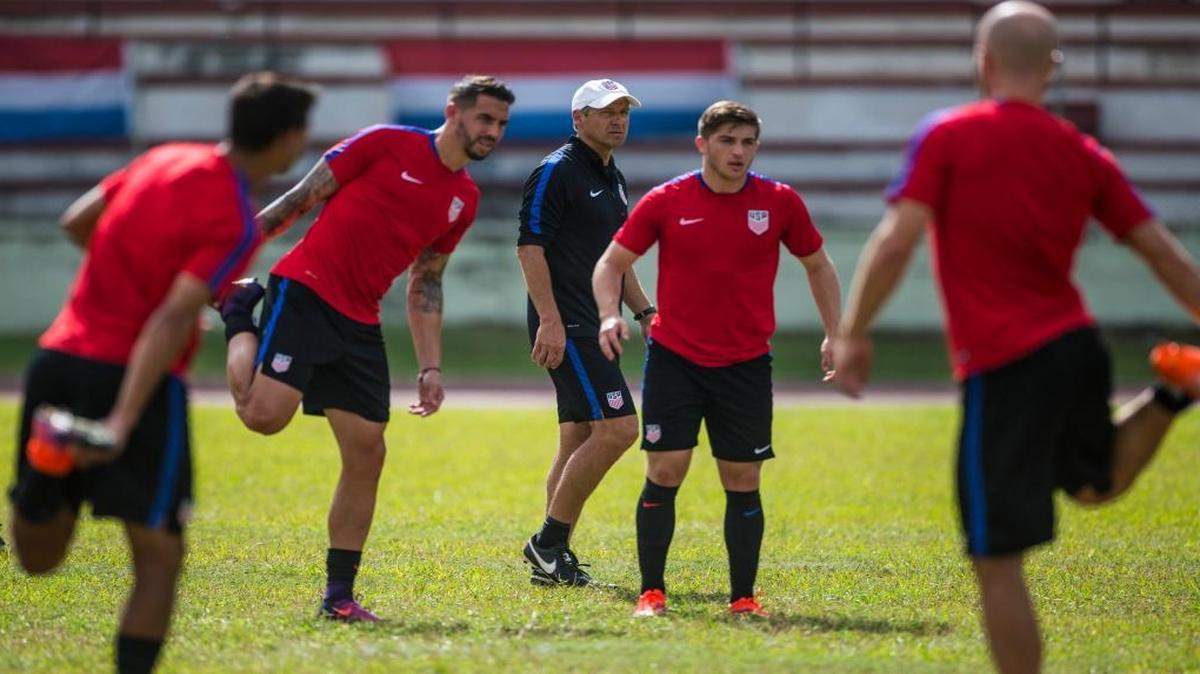 The United States national soccer team coach Jurgen Klinsmann, center, watches his players during a training session at Pedro Marrero Stadium in Havana, Cuba, Thurs., Oct. 6, 2016. Cuba will play a friendly soccer match with the U.S. on Fri., Oct. 7.