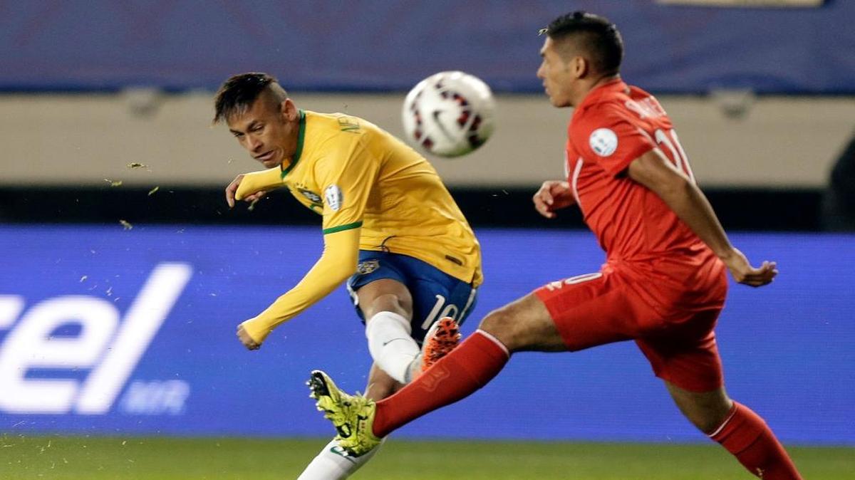 Brazil's Neymar kicks the ball against Peru during a Copa America Group C soccer match in Temuco, Chile, on June 14, 2015.