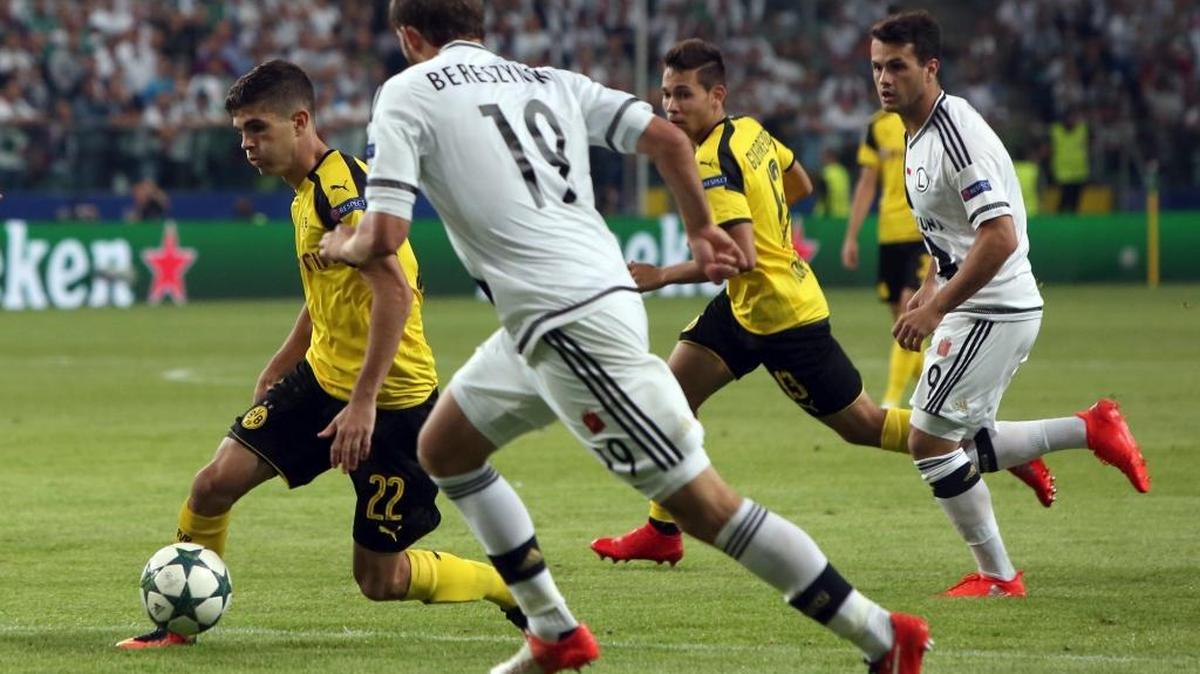 Dortmund’s Christian Pulisic, left, looks for open ground during the Champions League Group F soccer game against Legia Warsaw in Poland on Wednesday, Sept. 14, 2016. Pulisic, an American who turns 18 on Sunday, became the youngest Dortmund player ever to play in a Champions League match.