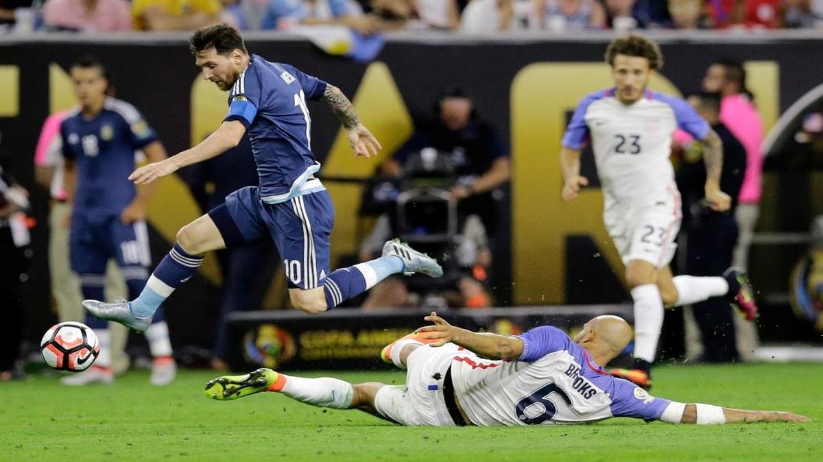 Argentina's Lionel Messi (10) chases the ball over United States' John Brooks (6) during a Copa America Centenario soccer semifinal, Tues., June 21, 2016, in Houston. Argentina won 4-0.