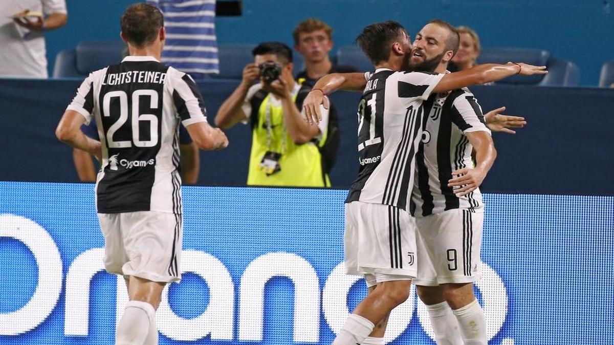 Juventus forward Gonzalo Higuain is congratulated by teammates after scoring against Paris Saint-Germain during the first half of an International Champions Cup soccer match on Wed., July 26, 2017, at Hard Rock Stadium in Miami Gardens.