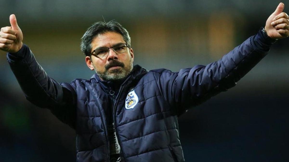 Former U.S. national team forward David Wagner led Huddersfield Town to promotion to the English Premier League and the team won its first two games.