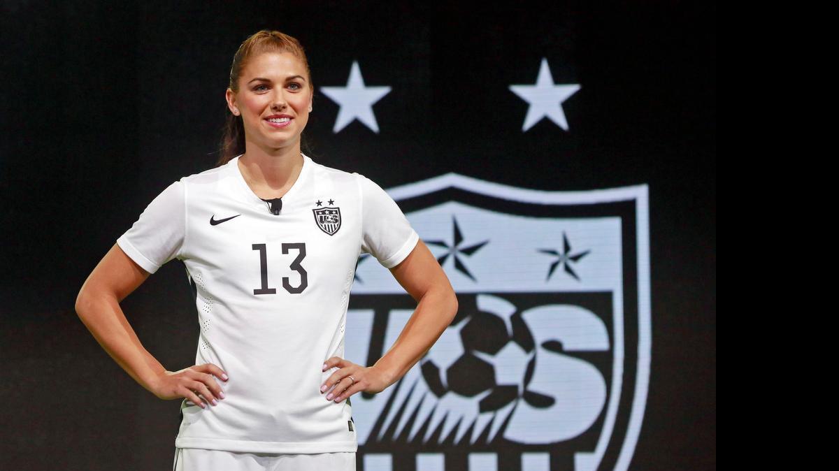 
Team USA forward Alex Morgan poses in the new black and white home uniform for the U.S. women's World Cup soccer team during a news conference in Los Angeles on April 22, 2015.
