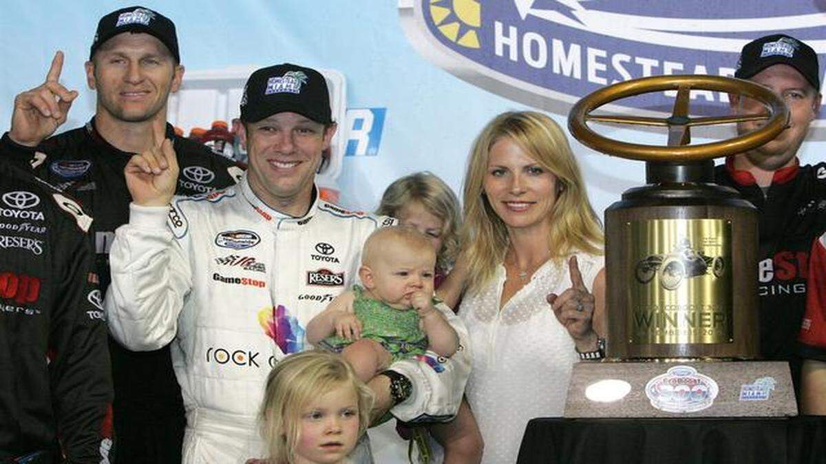 
Race winner: Matt Kenseth celebrates his Nationwide Series Ford EcoBoost 300 victory with his family and crew at Homestead-Miami Speedway.
