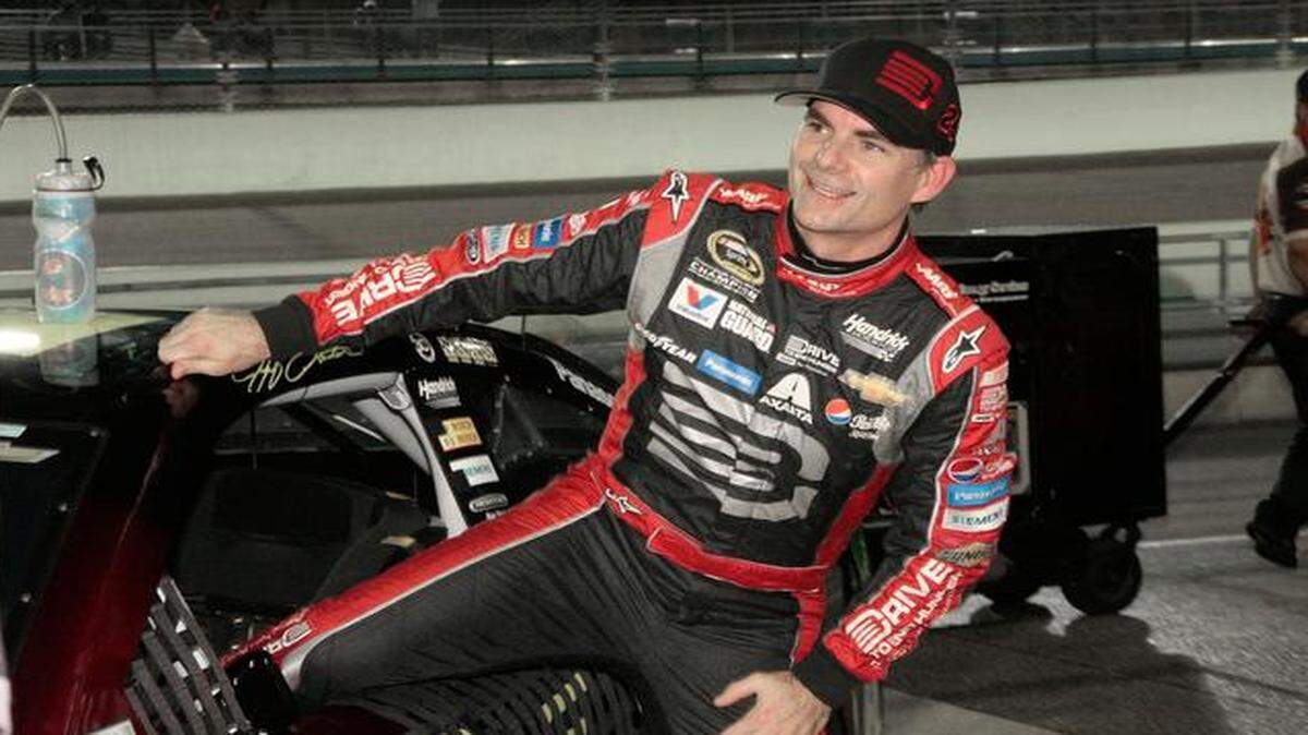 
Jeff Gordon celebrates after qualifying laps for the EcoBoost 400 auto race, Friday, Nov. 14, 2014 in Homestead, Fla. He won the pole position.
