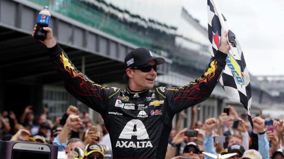 Jeff Gordon celebrates after winning the 2014 Brickyard 400 at Indianapolis Motor Speedway. Gordon will replace Dale Earnhardt Jr. in Sunday’s Cup race at Indy as Earnhardt battles balance issues and nausea.