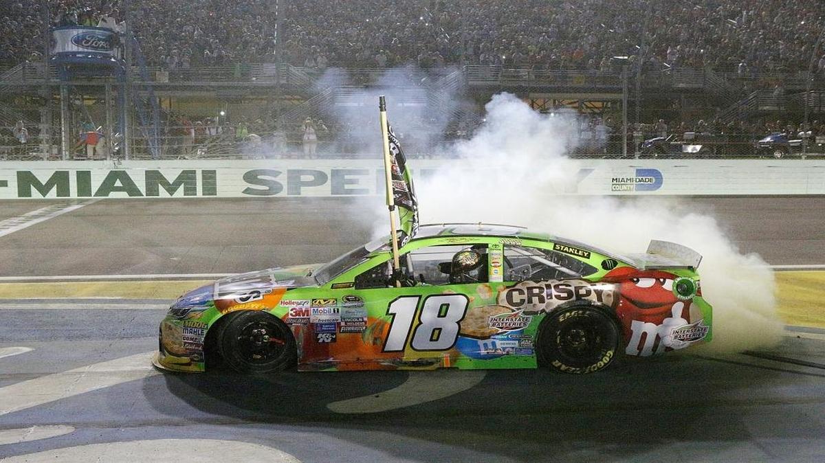 NASCAR driver Kyle Busch performs burnout after winning the NASCAR Sprint Series Ford EcoBoost 400 race and championship on Sunday, November 22, 2015 at Homestead-Miami Speedway