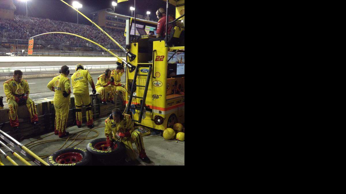
The pit crew of NASCAR Sprint Cup driver Joey Logano is shown after a disastrous pit stop which effectively ended his chance at winning the Ford EcoBoost 400 and the Sprint Cup championship at Homestead-Miami Speedway in Homestead of Nov. 16, 2014.
