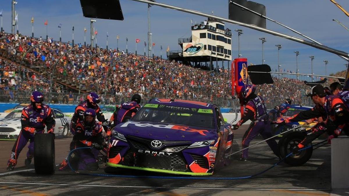 Denny Hamlin, driver of the #11 FedEx Ground Toyota, pits during the Monster Energy NASCAR Cup Series Can-Am 500 at Phoenix International Raceway on Nov. 12, 2017, in Avondale, Arizona. Former Miami Dolphins defensive lineman Nate Bolling is a jackman for Hamlin.