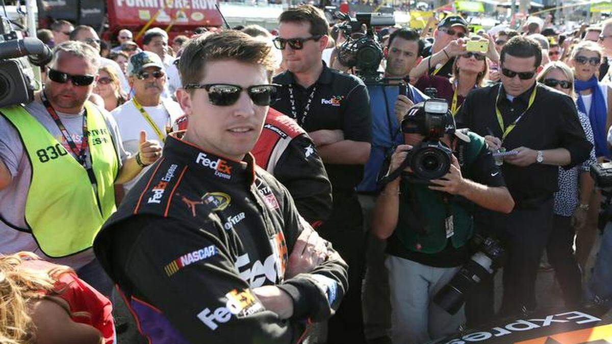 
Restart trouble: Denny Hamlin, posing for photographers before the race, said afterward, ‘I thought we had the best car, and we just struggled with restart speed. Kind of the theme of the year.’ 
